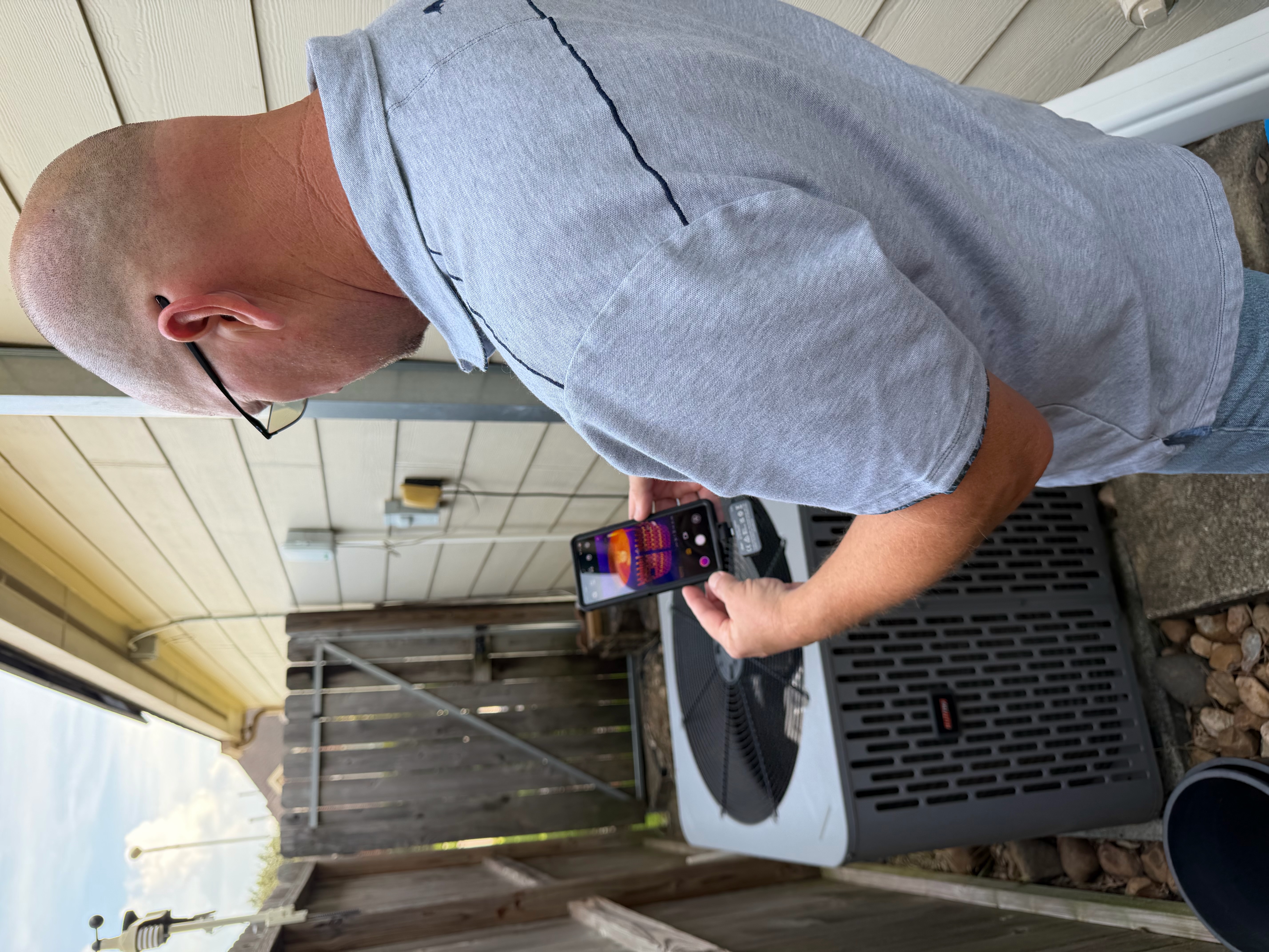 Dave Tague using thermal imaging to inspect an HVAC system
