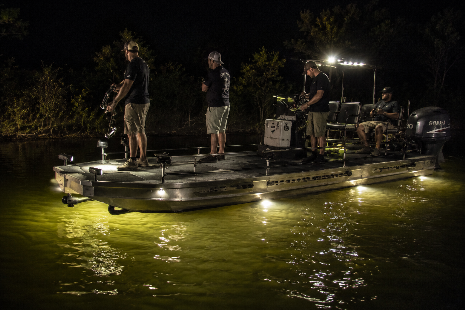 Veteran bowfishing at night
