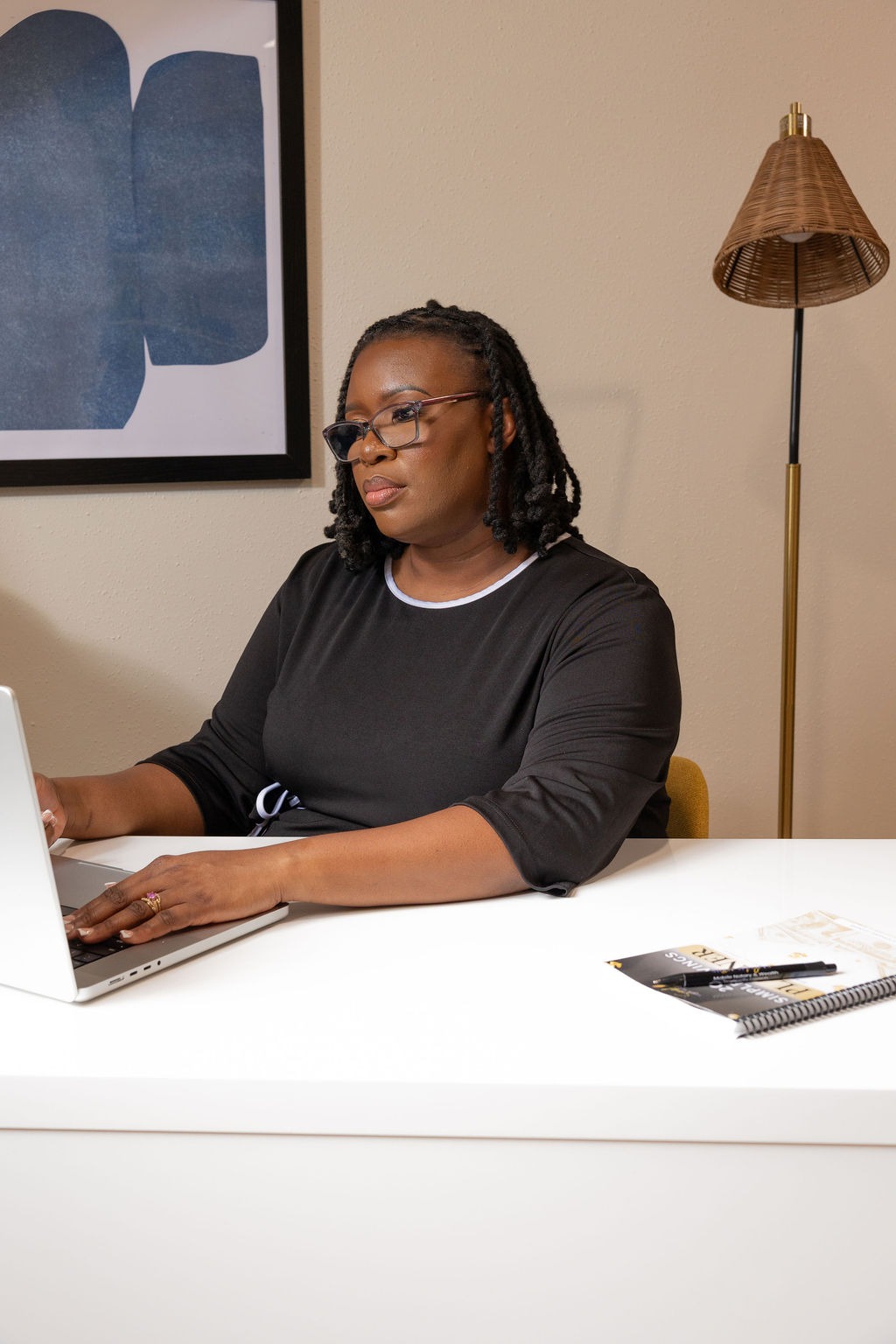 Stephanie Leandre conducting a remote online notarization on laptop