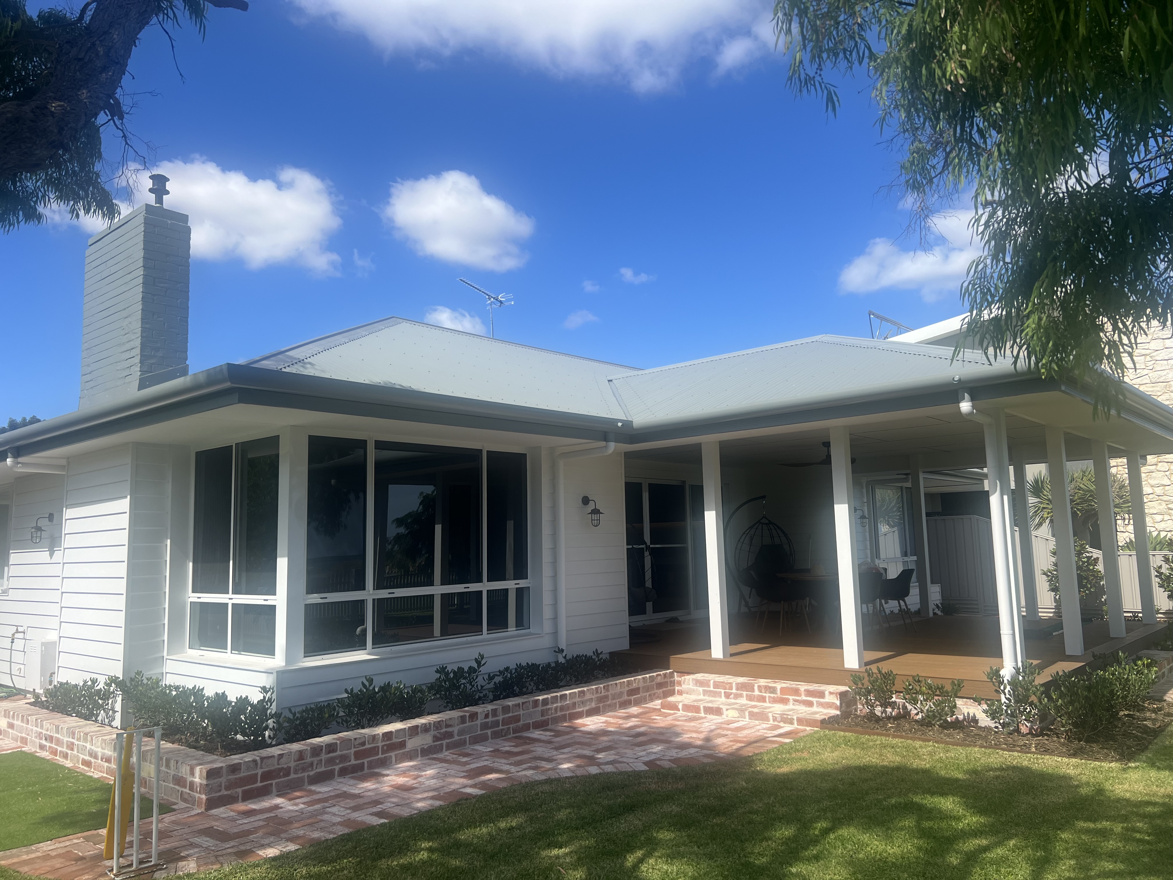 Renovated weatherboard home exterior with covered verandah in South West WA