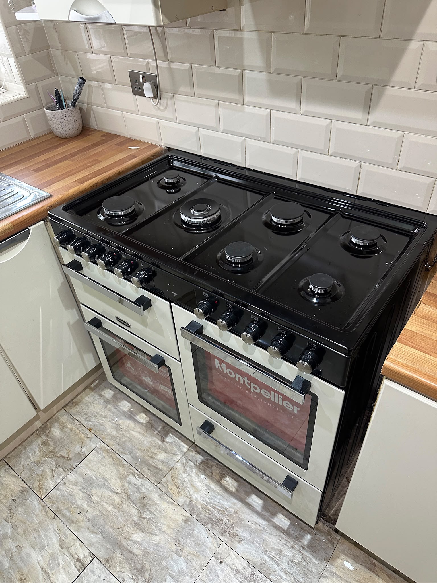Modern freestanding Montpellier gas cooker safely installed and connected