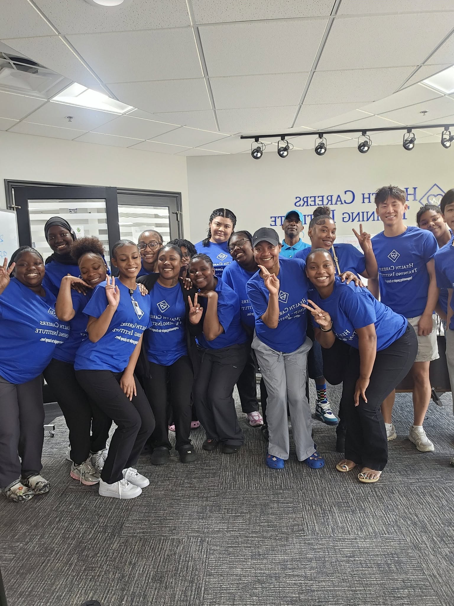 HCTI healthcare students training together in classroom