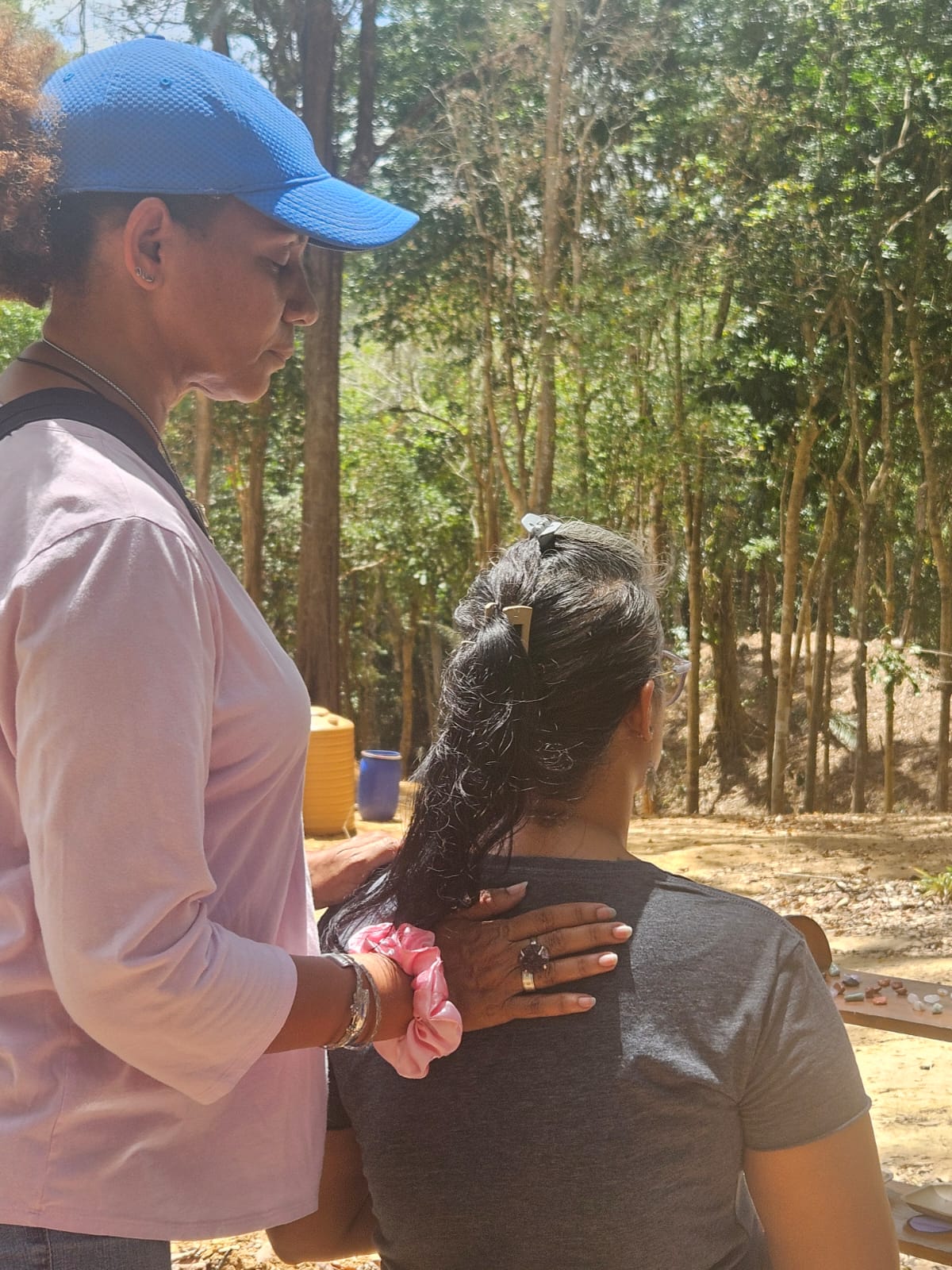 Energy healing session with therapeutic touch in forest setting