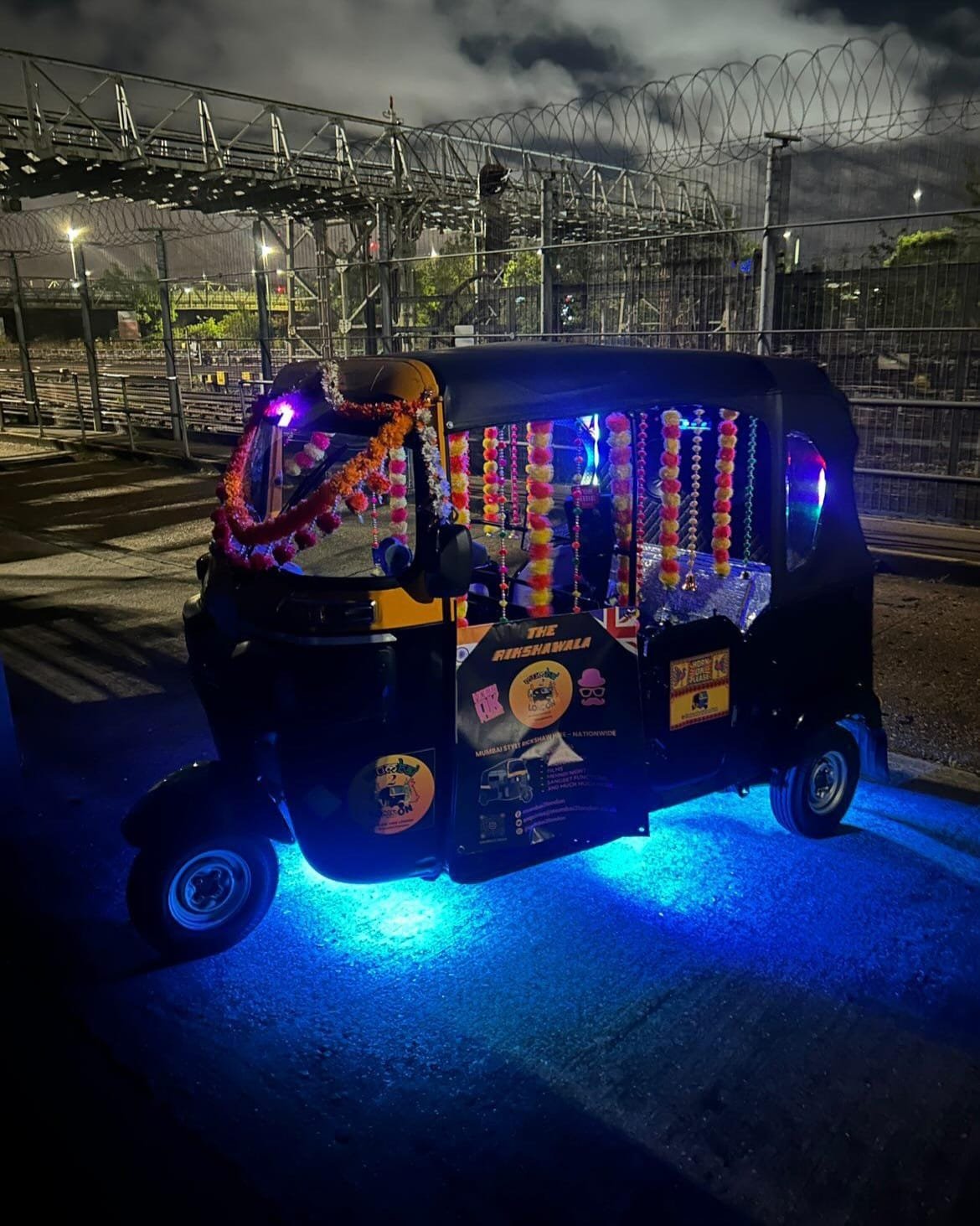 Custom neon underglow and warm cockpit ambient glow for night events.