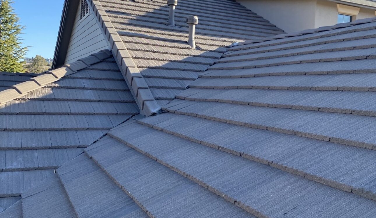 Yavapai Roofing inspector evaluating residential roof condition in Arizona