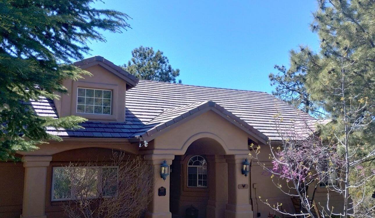 Completed Concrete Tile Roof on Prescott Arizona Home • Stucco Exterior with Desert Landscaping & Pine Trees