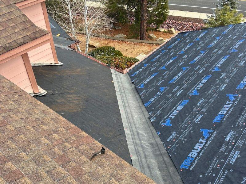Roof tear-off with GAF FeltBuster synthetic underlayment and WeatherWatch leak barrier installed in valleys during Prescott AZ re-roof