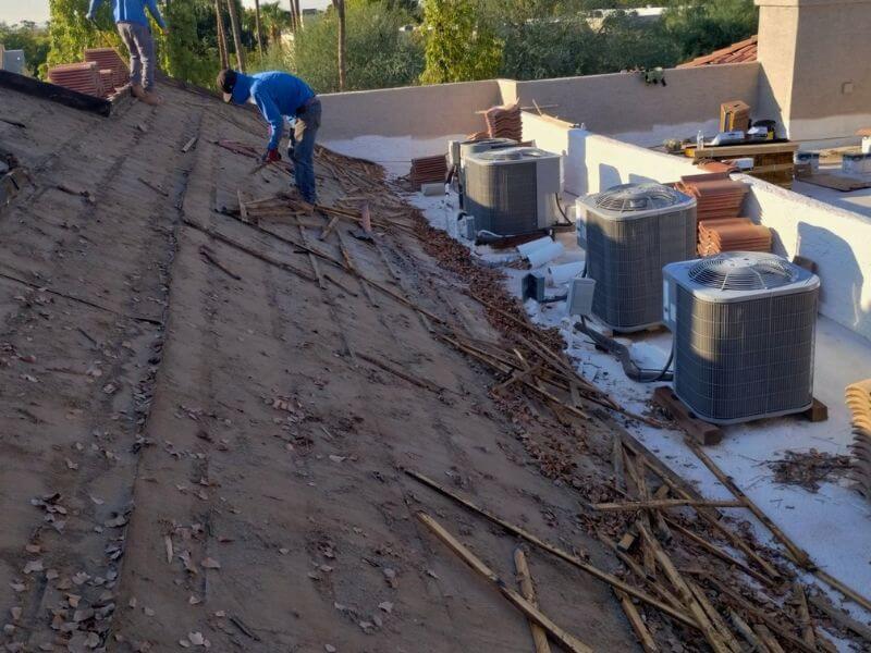 Tear-off of old deteriorated tile roof on a Phoenix metro area property before replacement