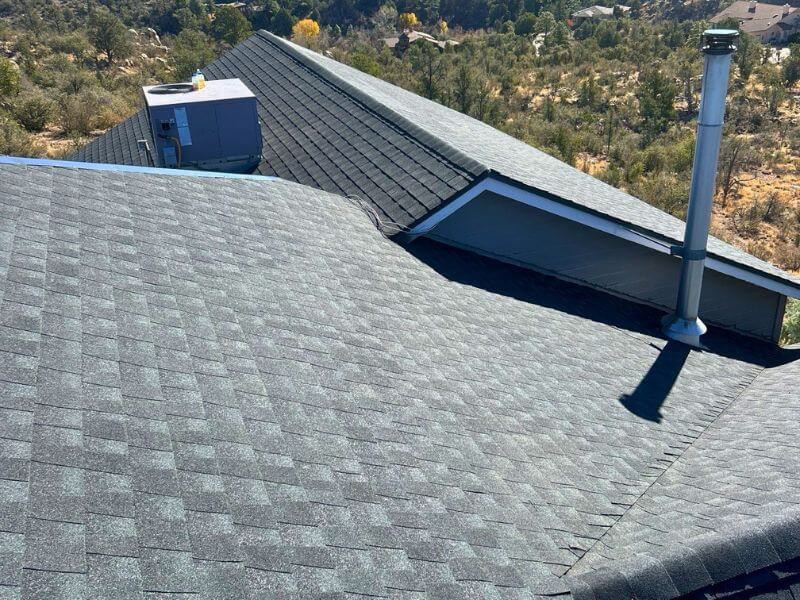 Completed architectural shingle roof replacement with dark gray GAF Timberline HDZ shingles in Prescott AZ