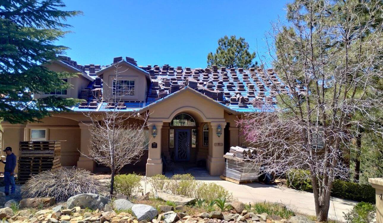 Completed concrete tile roof installation by Yavapai Roofing showing multi-plane tile system on Arizona home