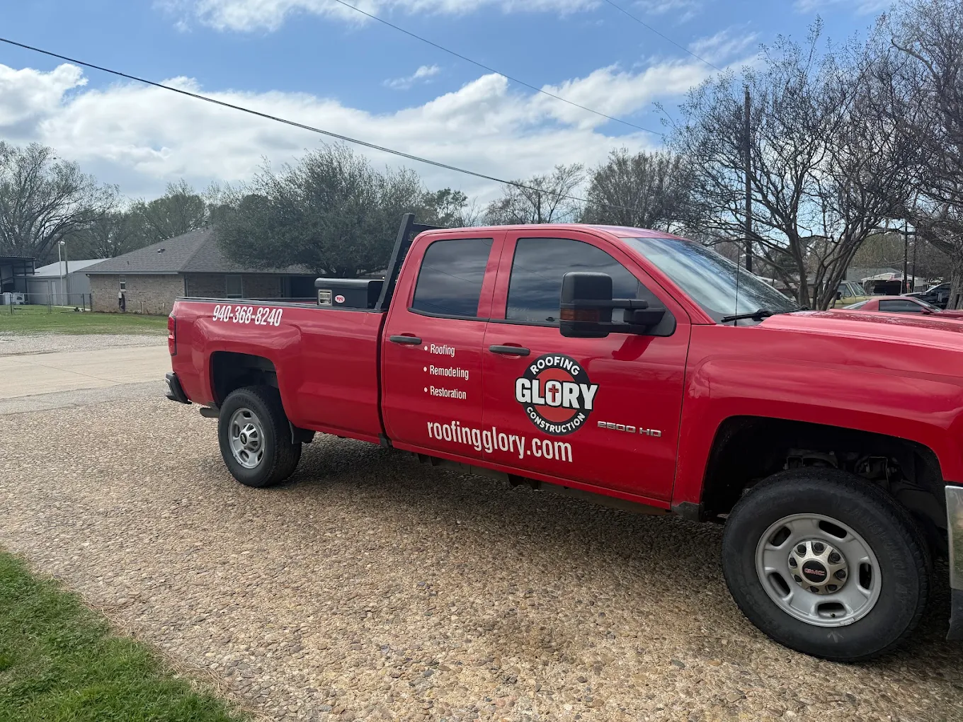 Glory Roofing and Construction branded red truck serving Dallas, Texas — fully insured local roofing contractor