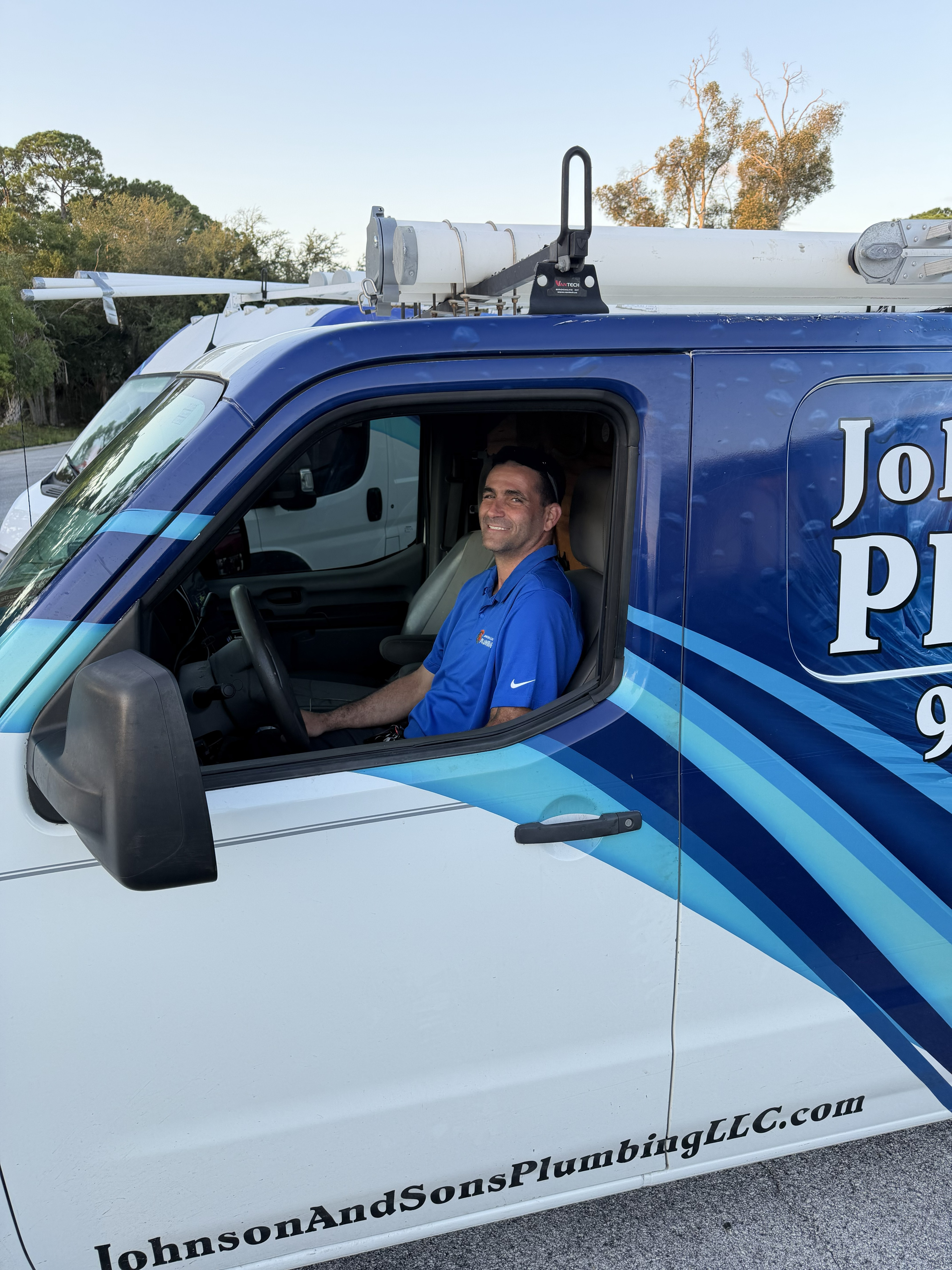 Johnson & Sons Plumbing crew member on a residential service call