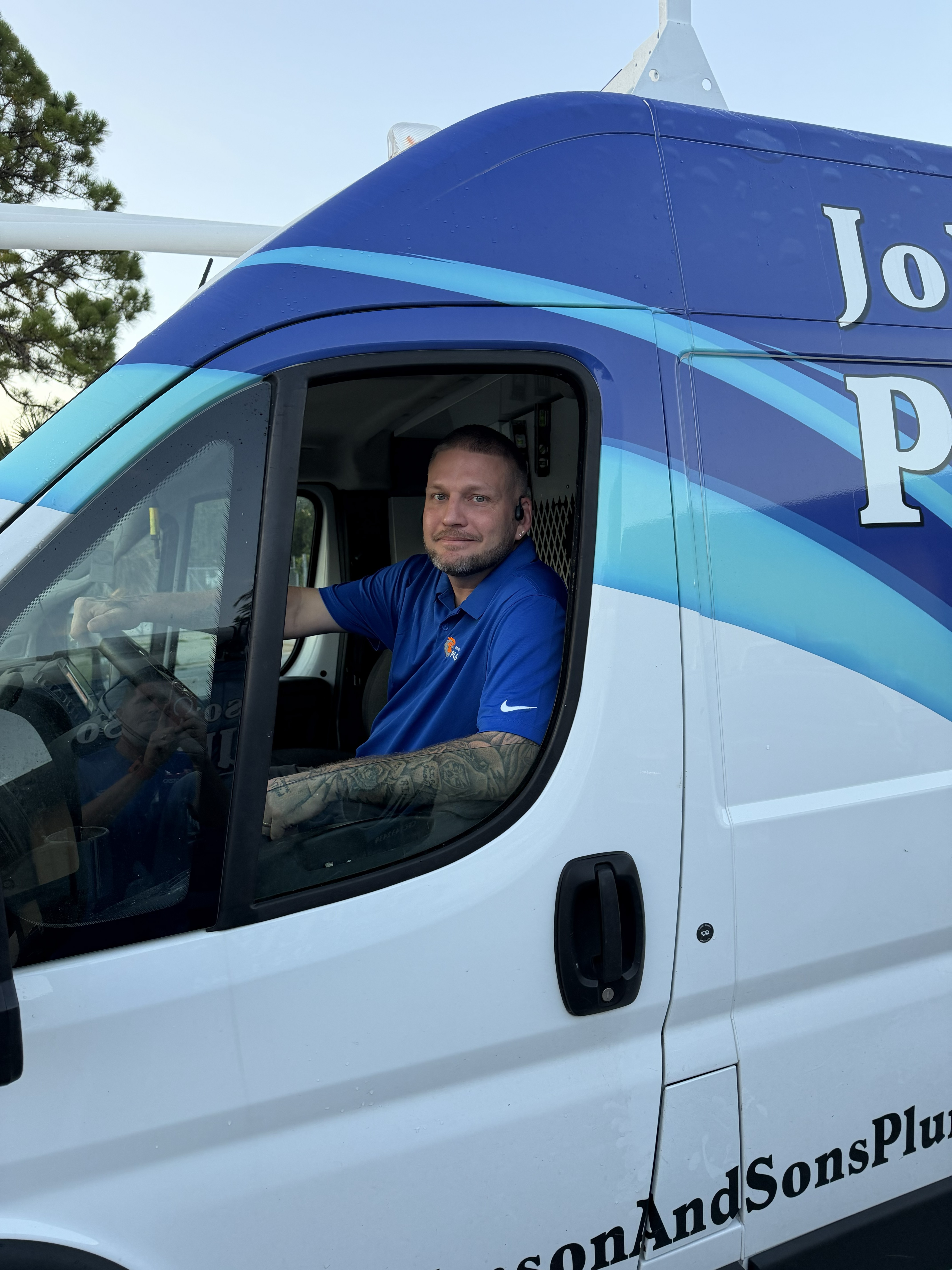 Steven from Johnson & Sons Plumbing in company service van serving Sarasota and Bradenton