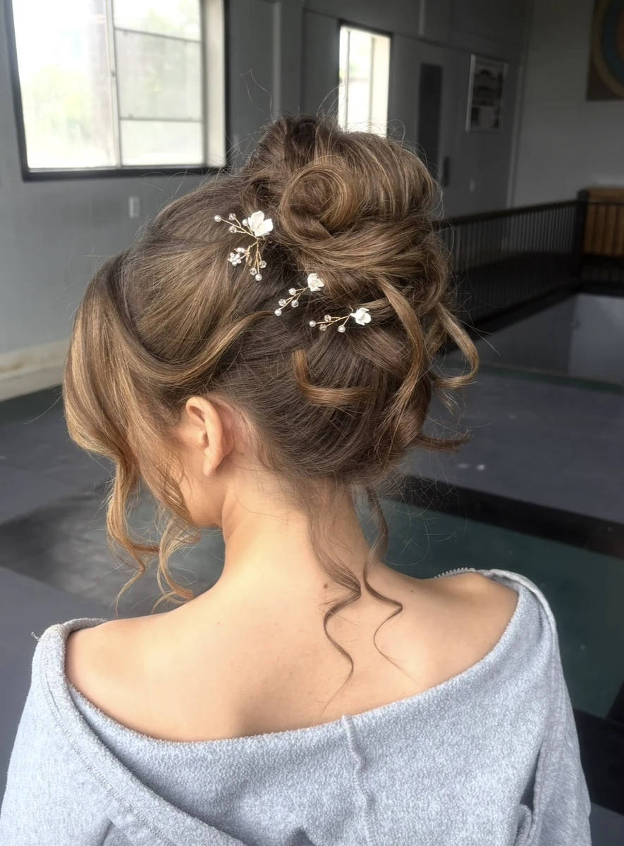Bridal up-style special occasion hair by Jessica Young — elegant wedding hair with loose tendrils and floral pins, full head visible