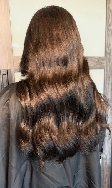 Rich chocolate brunette custom color with dimensional highlights by Jessica Young — glossy polished wave finish, full head visible