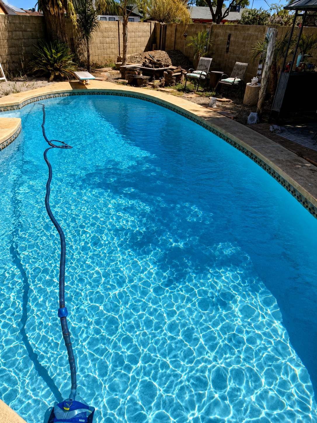 Clear blue swimming pool after professional green pool cleanup in Riverside