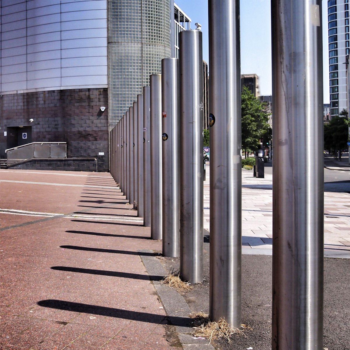 Steel bollards protecting a paved area at a commercial property in Arlington TX