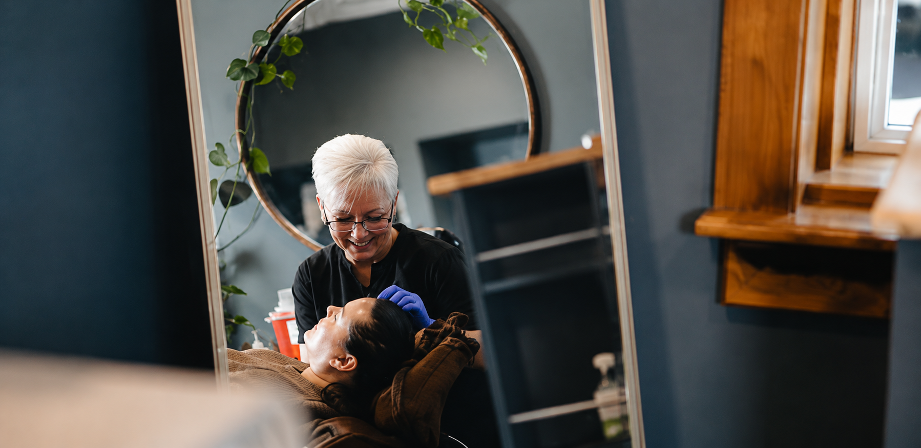 Dawn treating a client at D'Vinely You Aesthetics