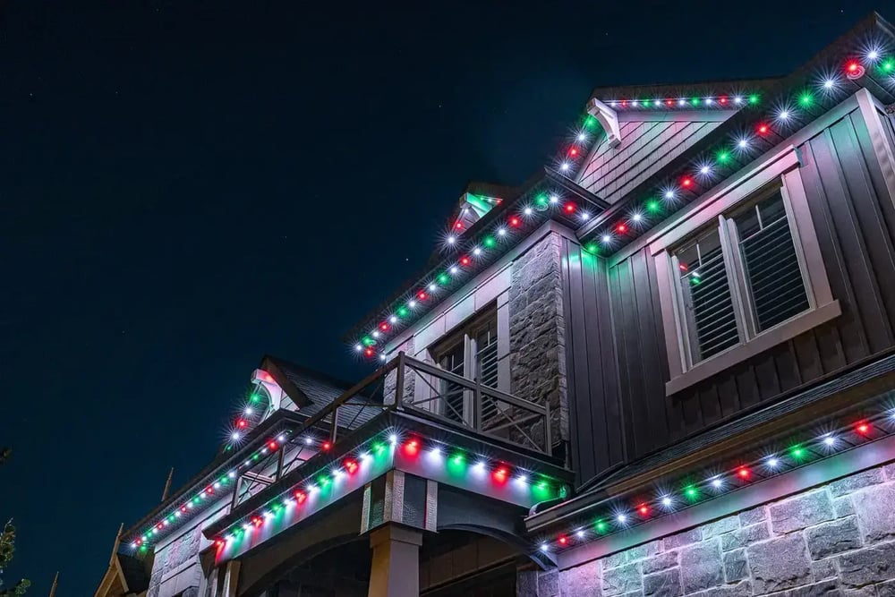 Vibrant multi-colour permanent holiday roofline lighting installation