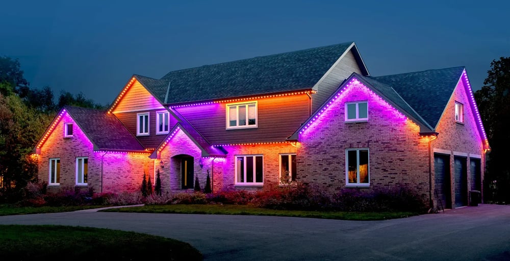 Warm white ambient architectural lighting along residential soffits and eaves