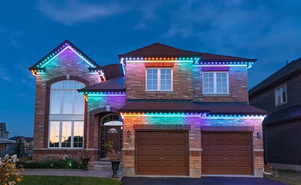 Architectural eave and gable permanent LED lighting on a multi-tier home