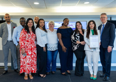 Apex Healthcare Services team receiving an award on stage