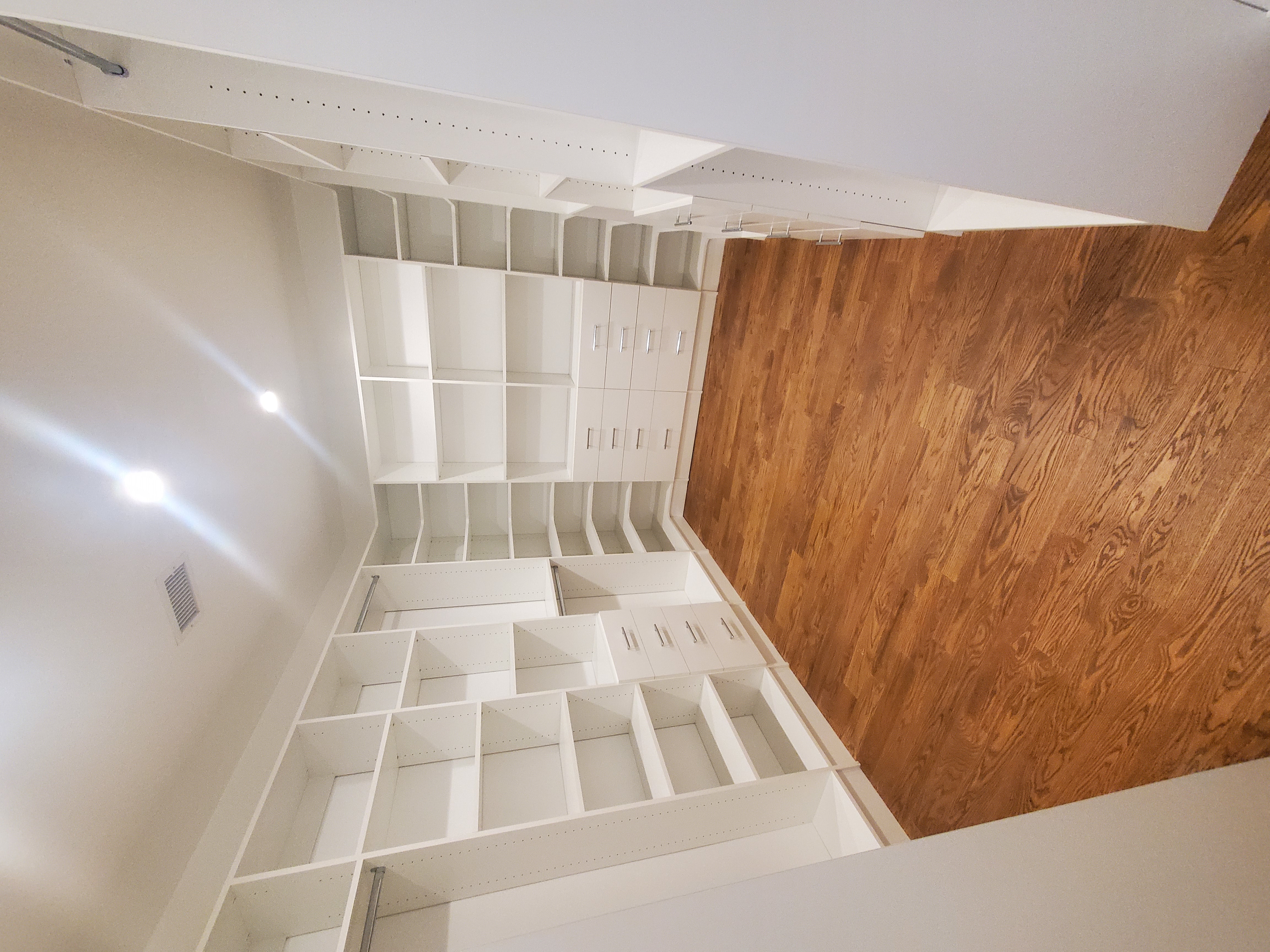 Custom closet installation with organized shelving and drawers in a New Jersey home