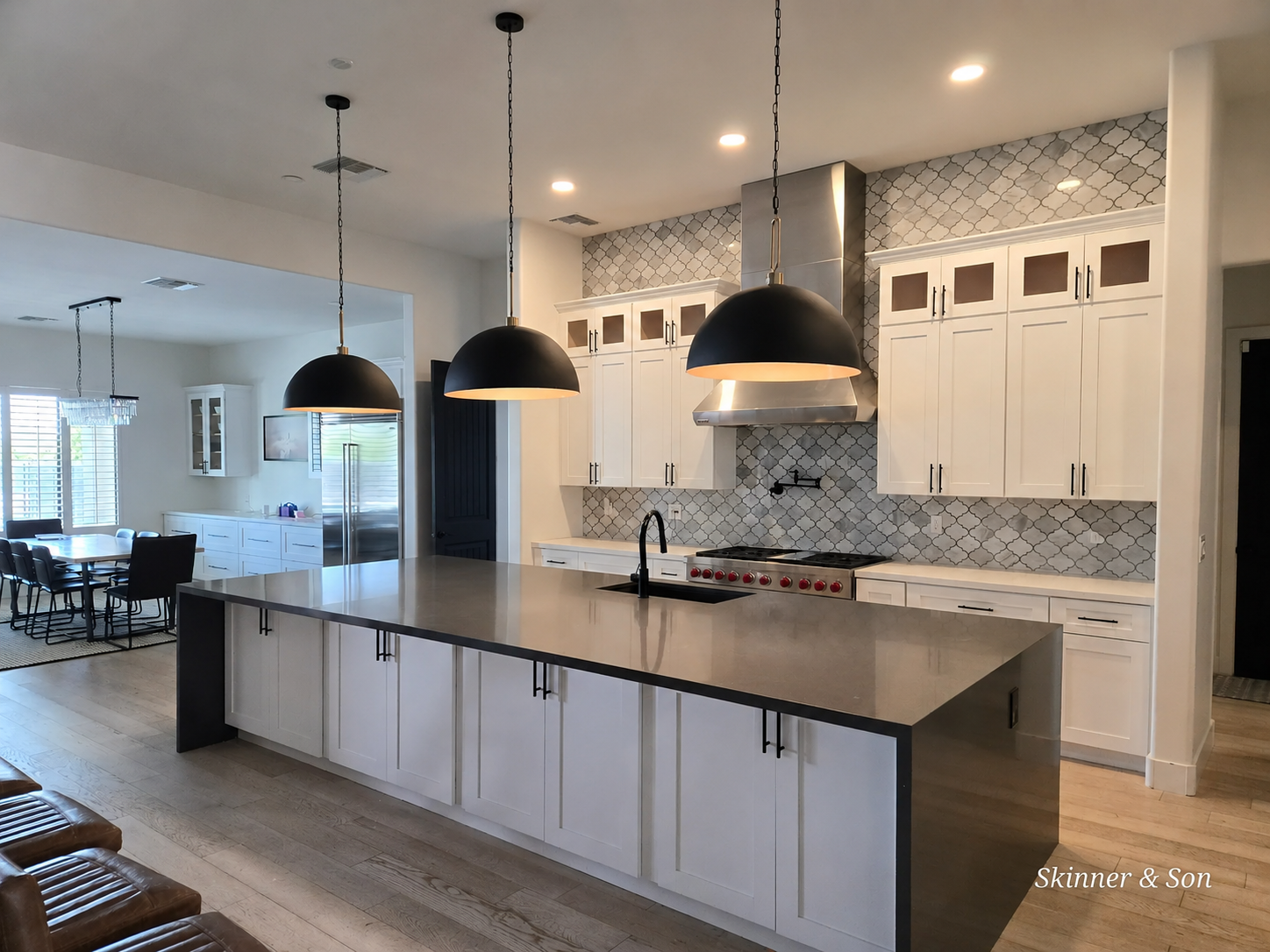 Completed kitchen remodel with white shaker cabinets and quartz countertops in a West Valley home