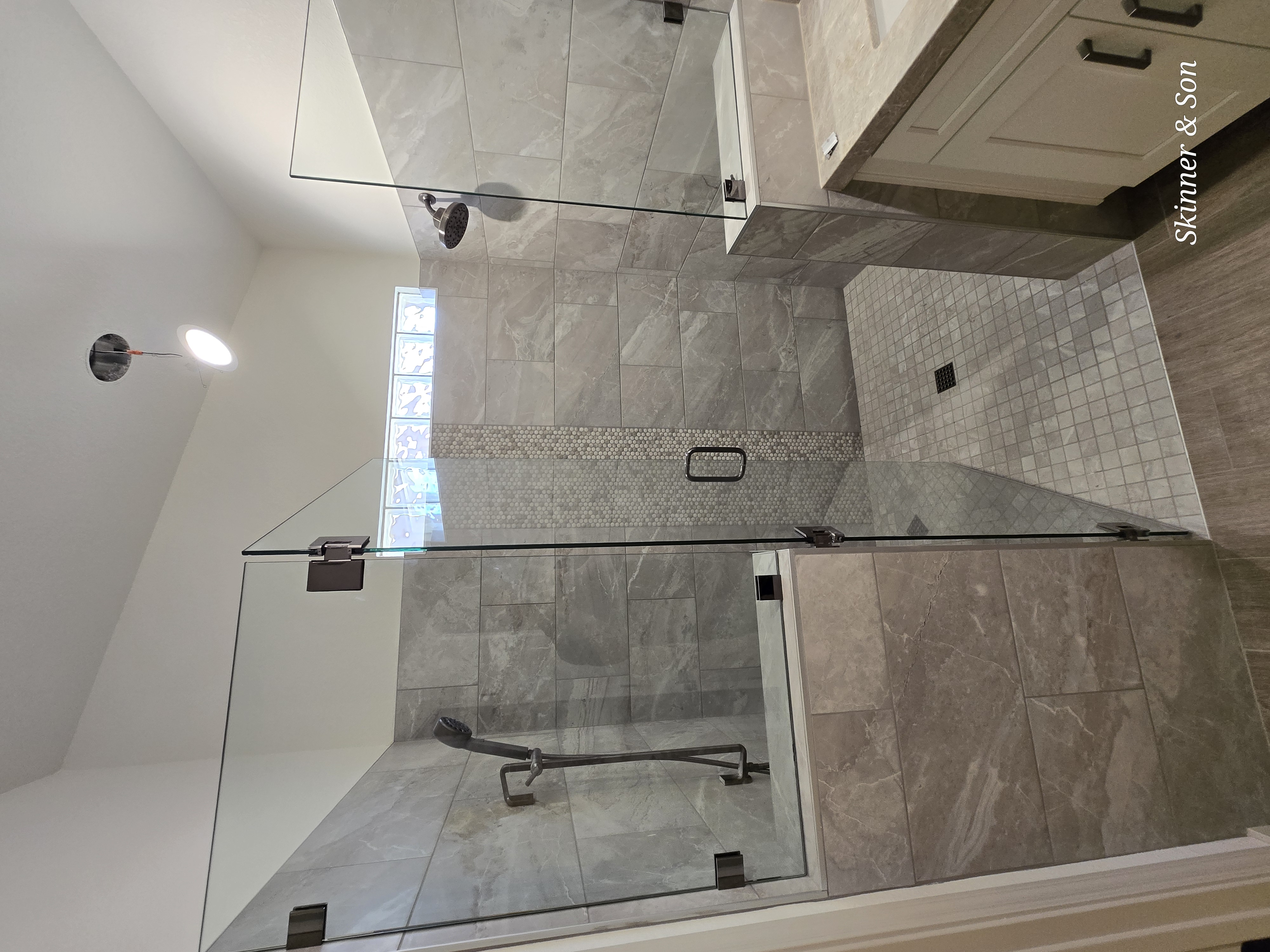 Bathroom remodel with walk-in shower and custom vanity in a West Valley home