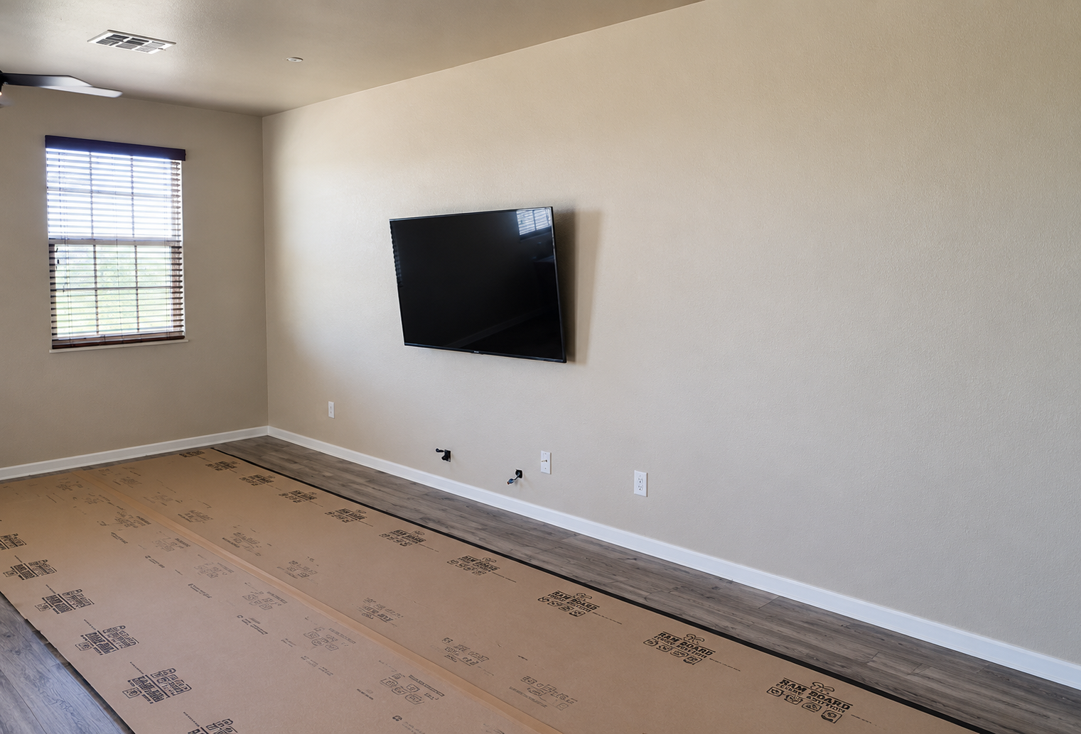 Living room wall before custom entertainment center in Litchfield Park, AZ