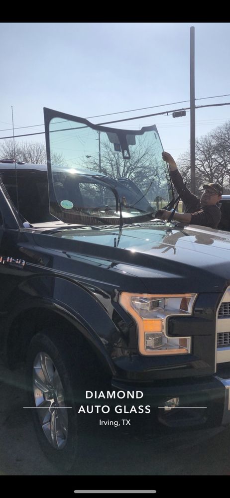 Diamond Auto Glass technician installing a new windshield on a Ford F-150 in Irving, Texas