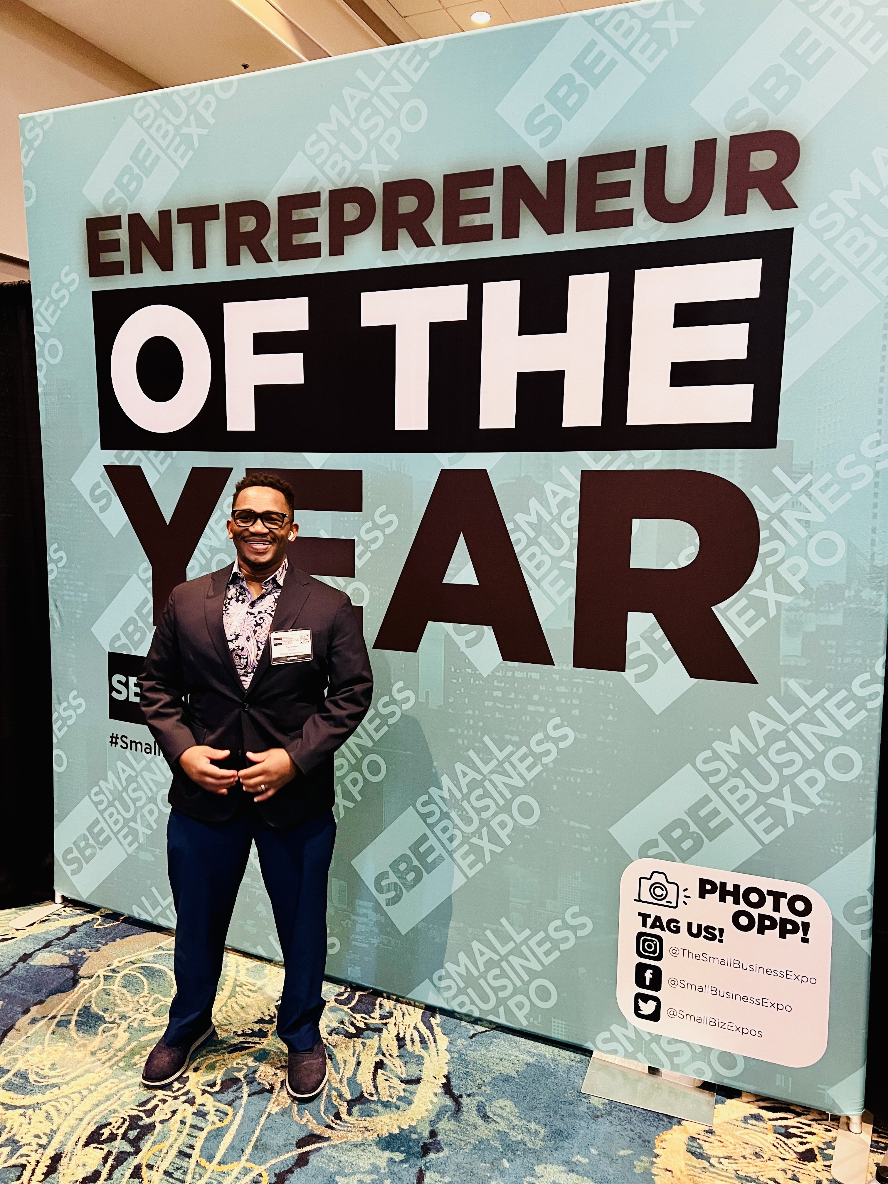 Levert Livingstone, founder of i4 Small Business Services, receiving Entrepreneur of the Year award at Small Business Expo