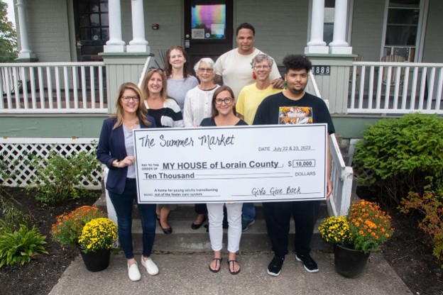 The Summer Market Girls Give Back grant check presentation to MY HOUSE of Lorain County