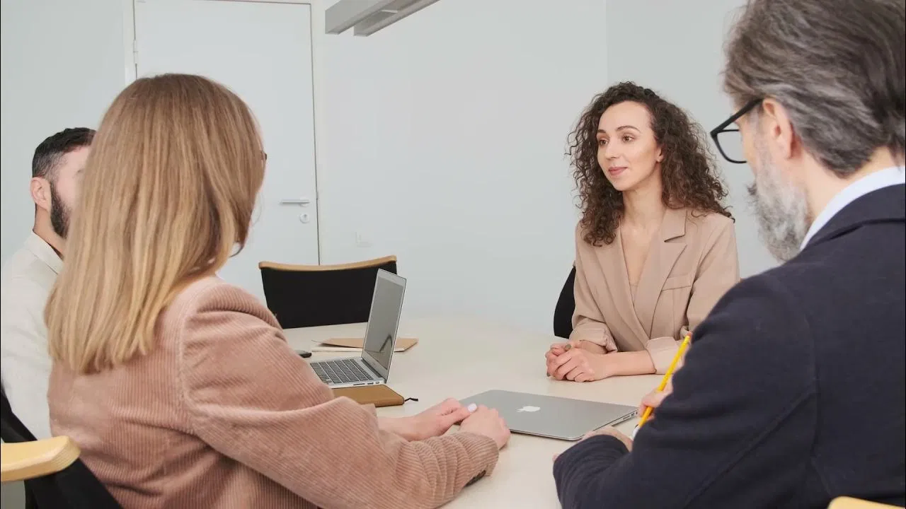 Executive team collaborating around a table during a business discussion