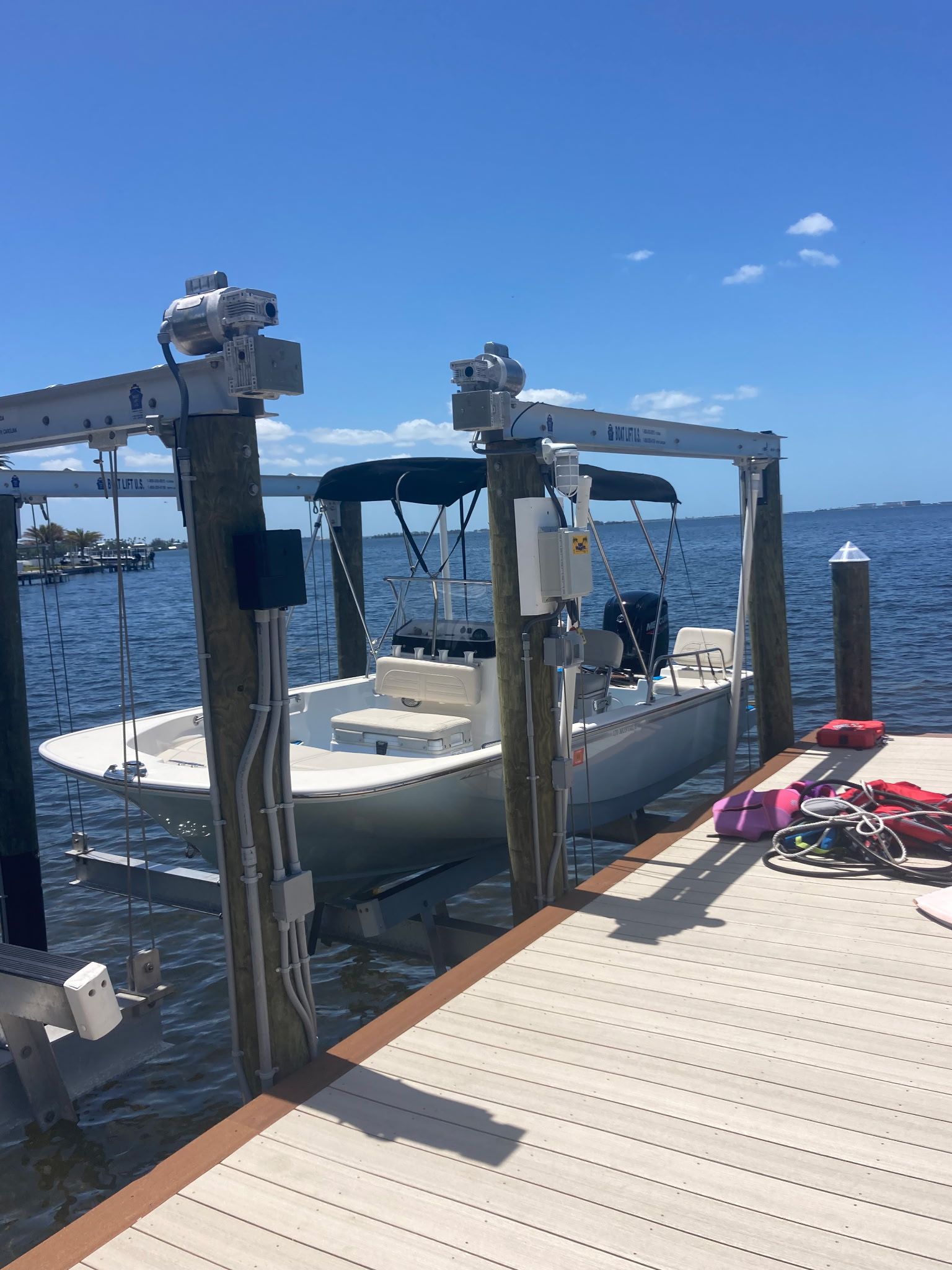 Dual boat lift electrical system on wooden dock — DRC Electric marine electrical