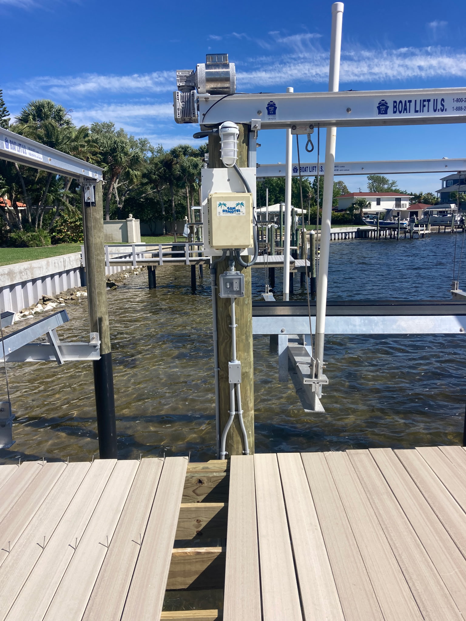 Boat lift electrical installation on waterfront dock