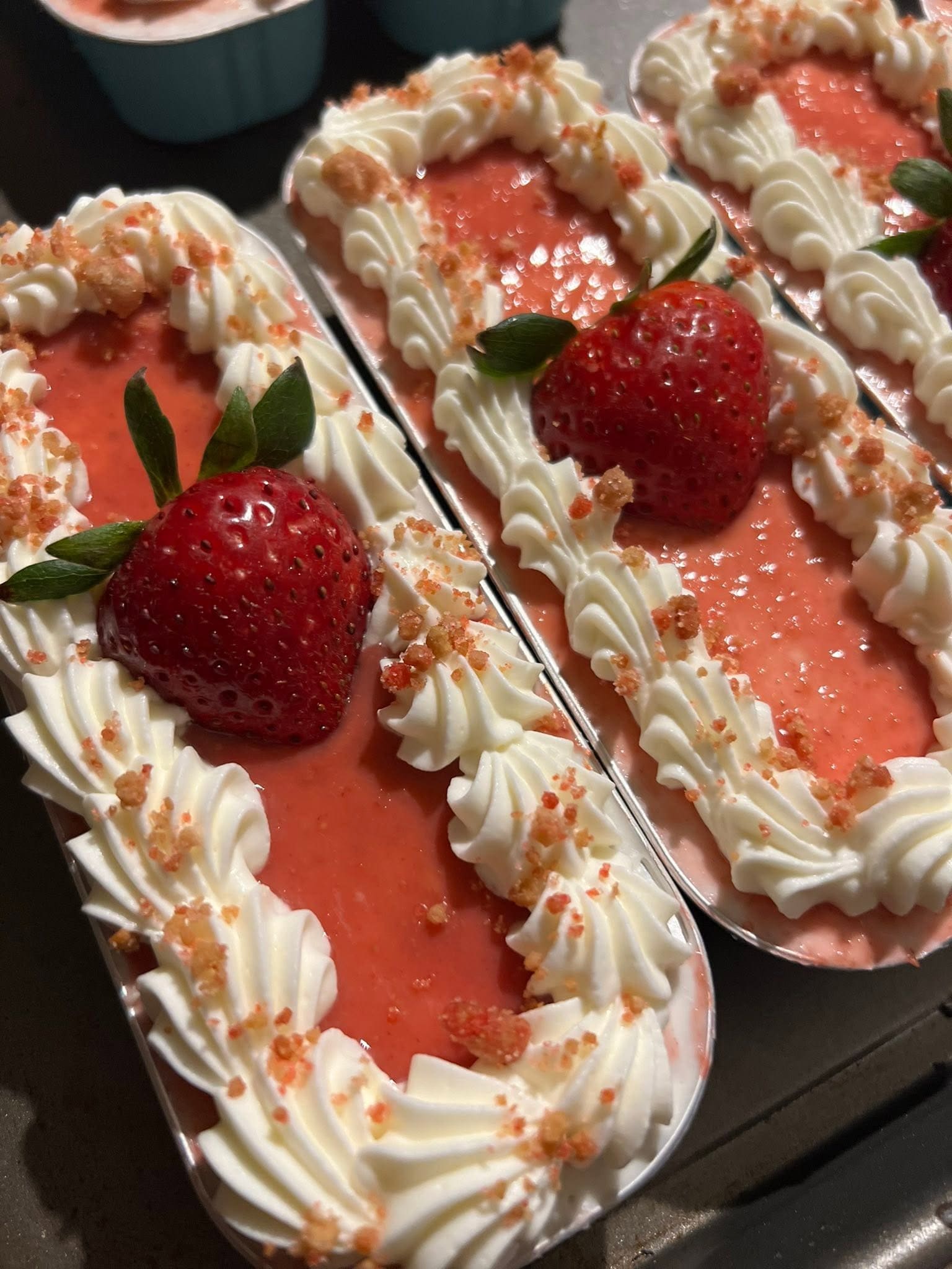 Strawberry dessert tarts with whipped cream rosettes fresh strawberries and golden crumble topping by Sweet Tooth Creations
