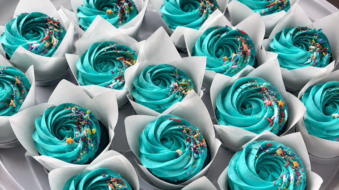 Decorated cupcakes with mint and blush pink buttercream swirls from Sweet Tooth Creations