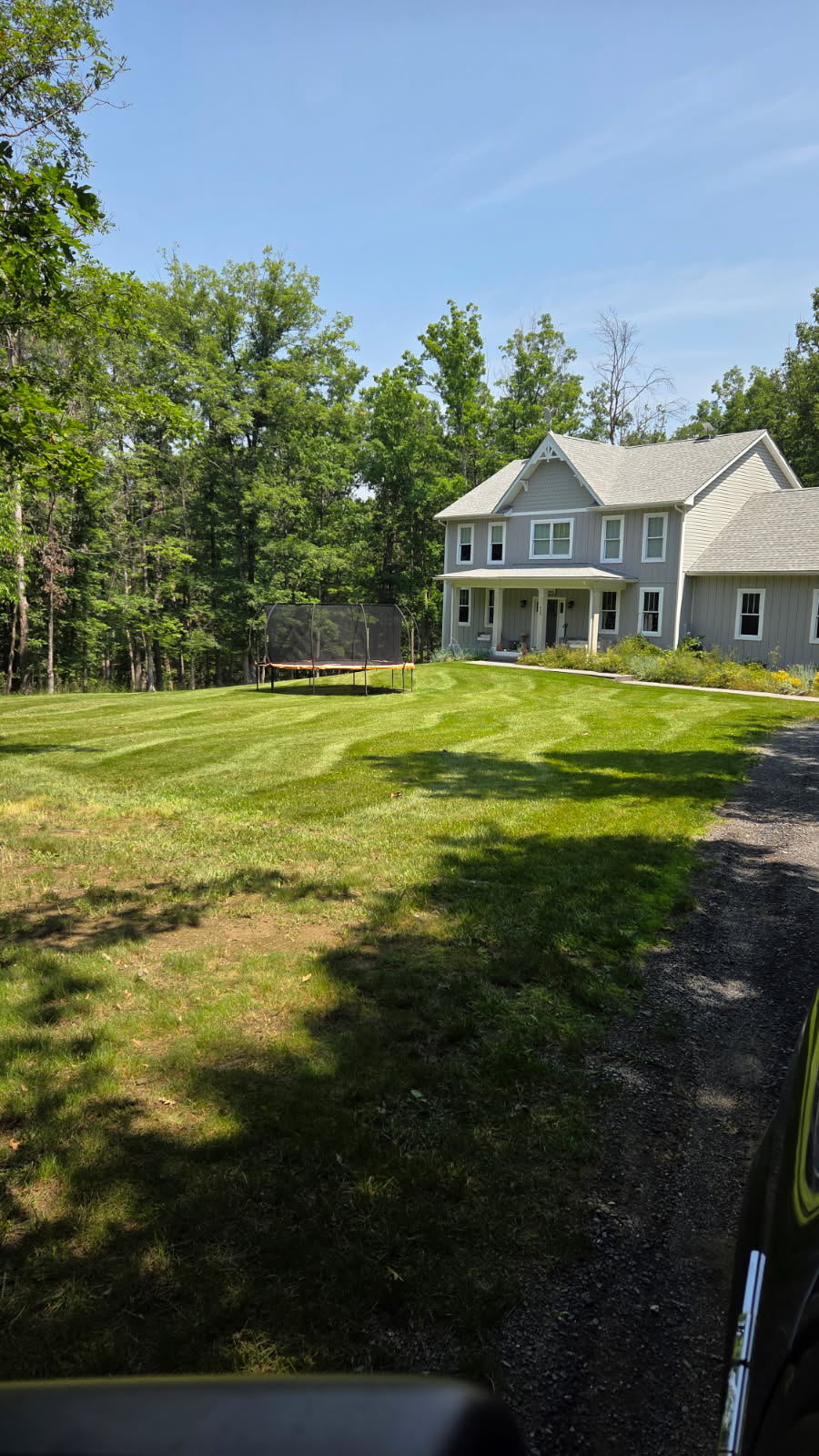Gray Farmhouse with Striped Lawn - Lawn Man LLC Winchester VA