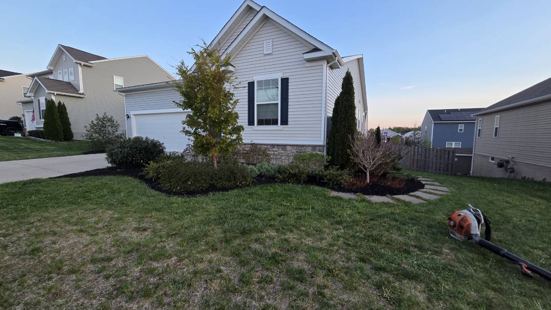 Suburban Landscaping with Stone Veneer Foundation - Lawn Man LLC Winchester VA