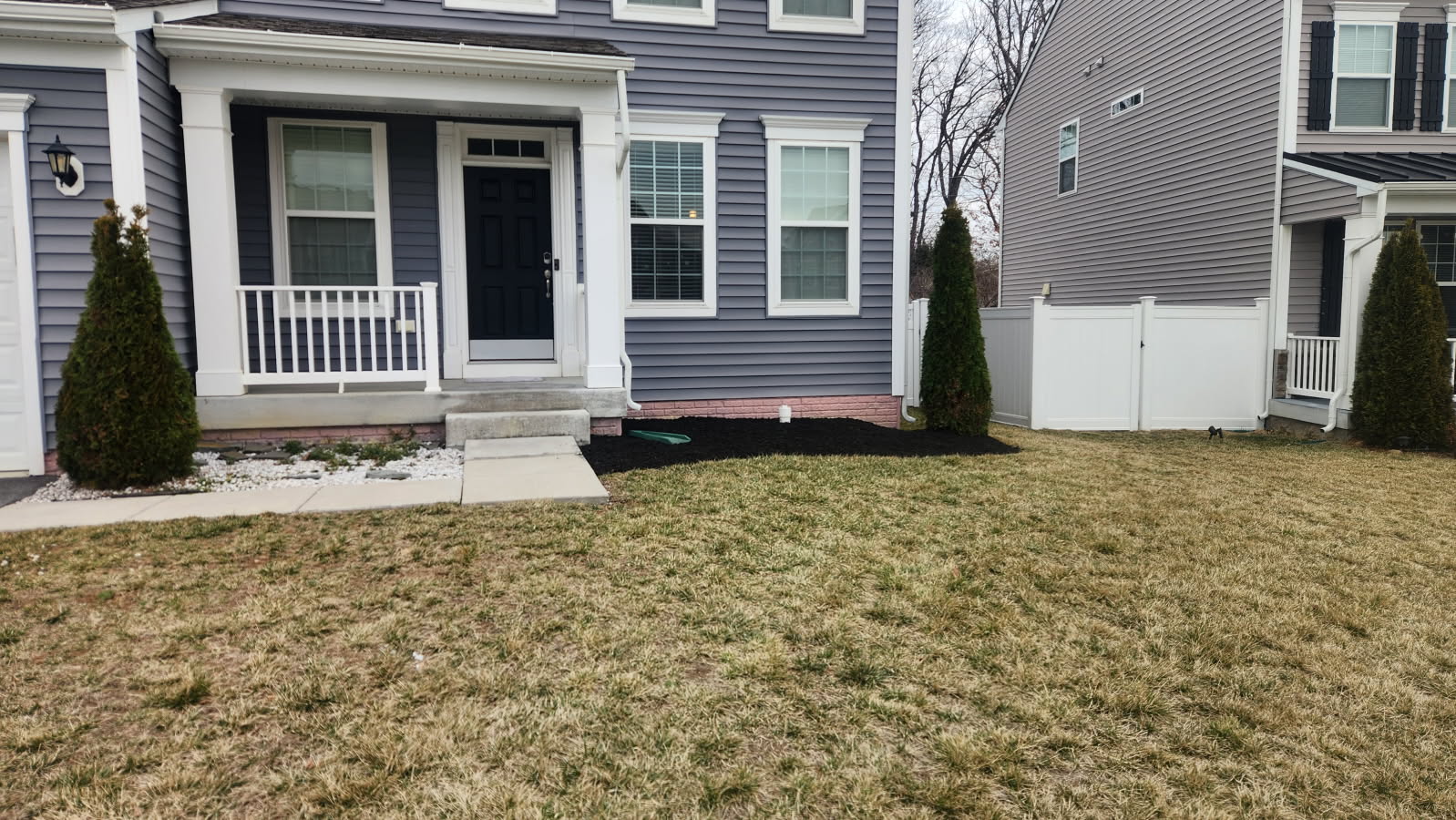 Gray House Mulch & Rock Bed - Lawn Man LLC Winchester VA