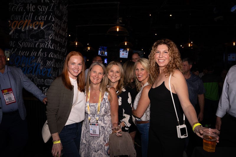 Guests celebrating successful charity fundraising at ISC West