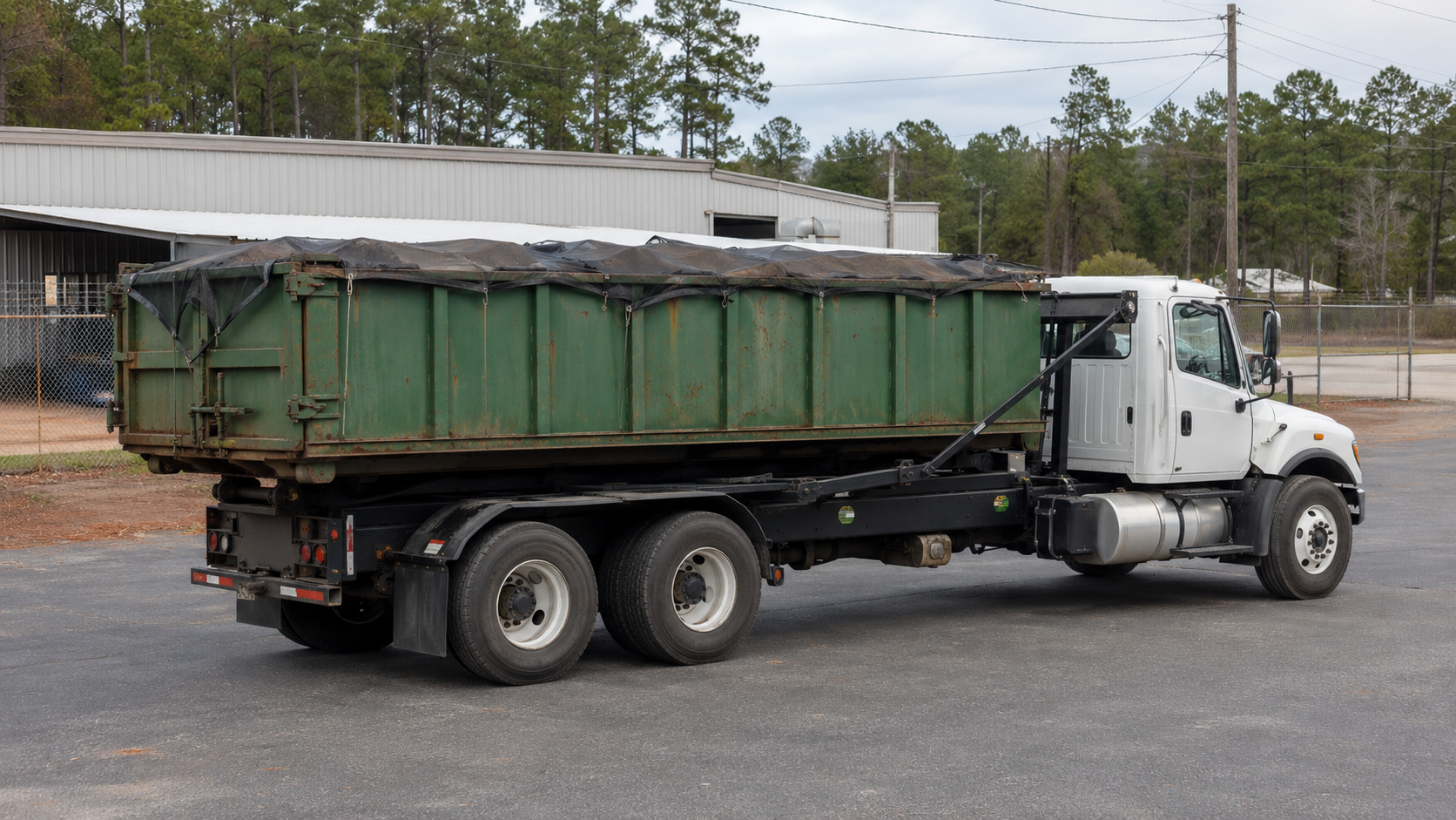 Max Compacx roll-off dumpster truck