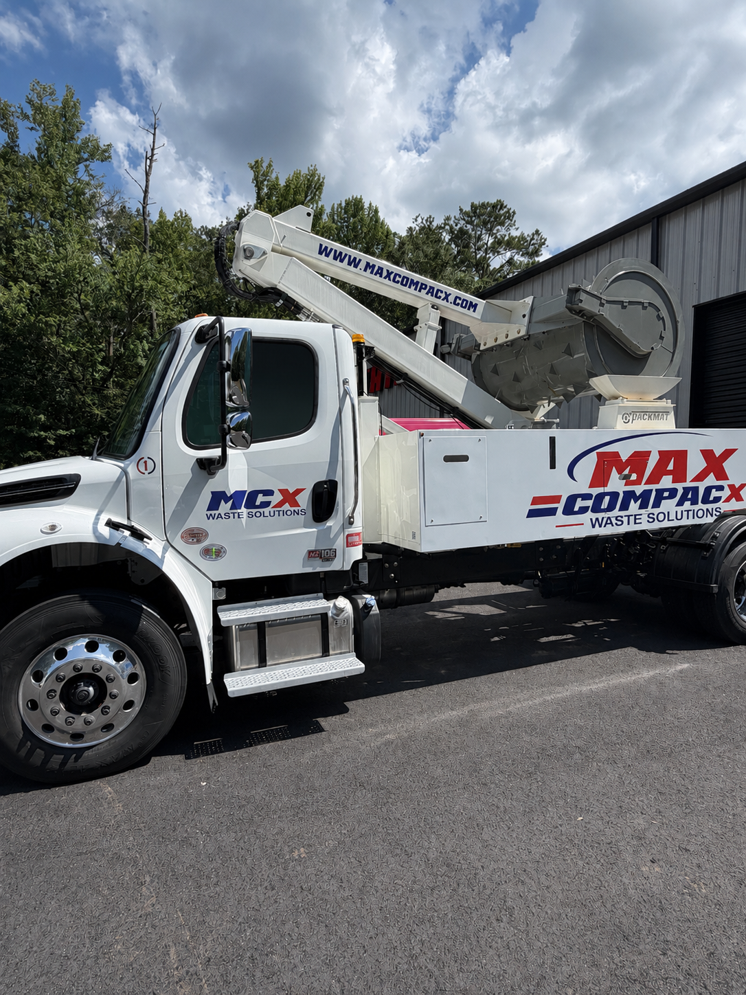 Max Compacx mobile compaction truck at a commercial facility