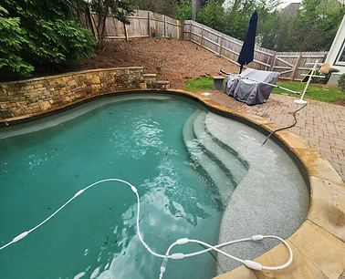 Seasonal pool opening - clean swimming pool ready for the season