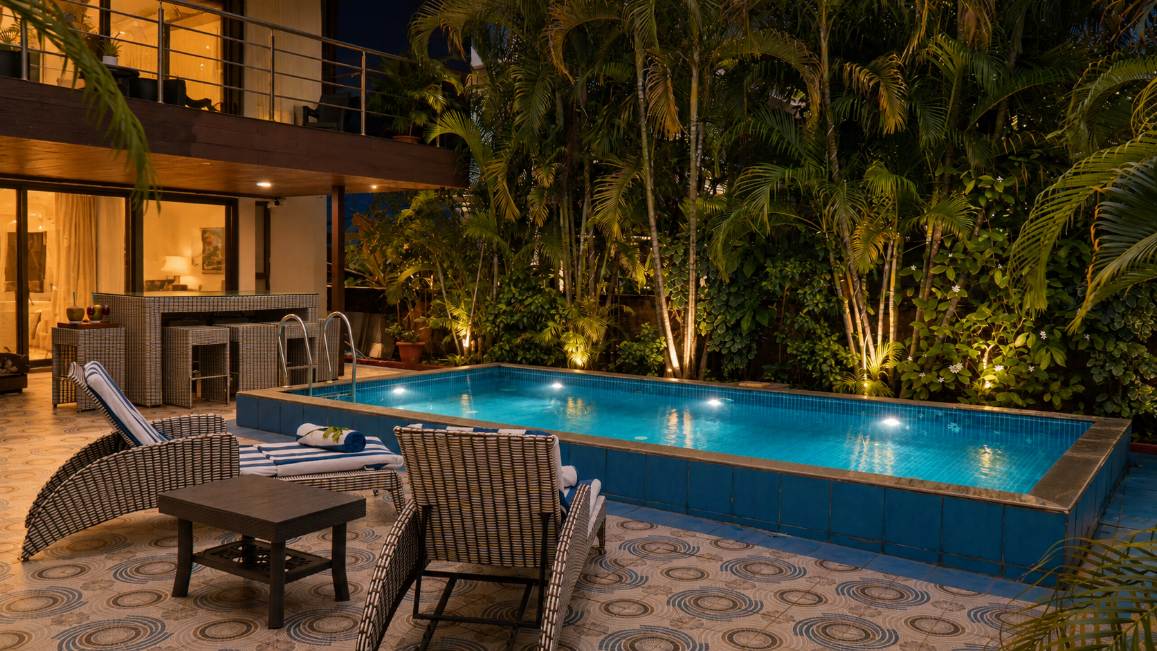 Illuminated luxury villa pool at night
