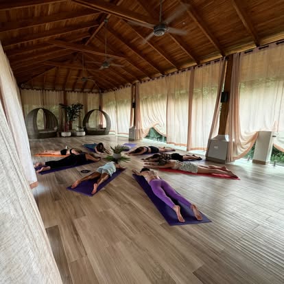 Open-air yoga shala practice session
