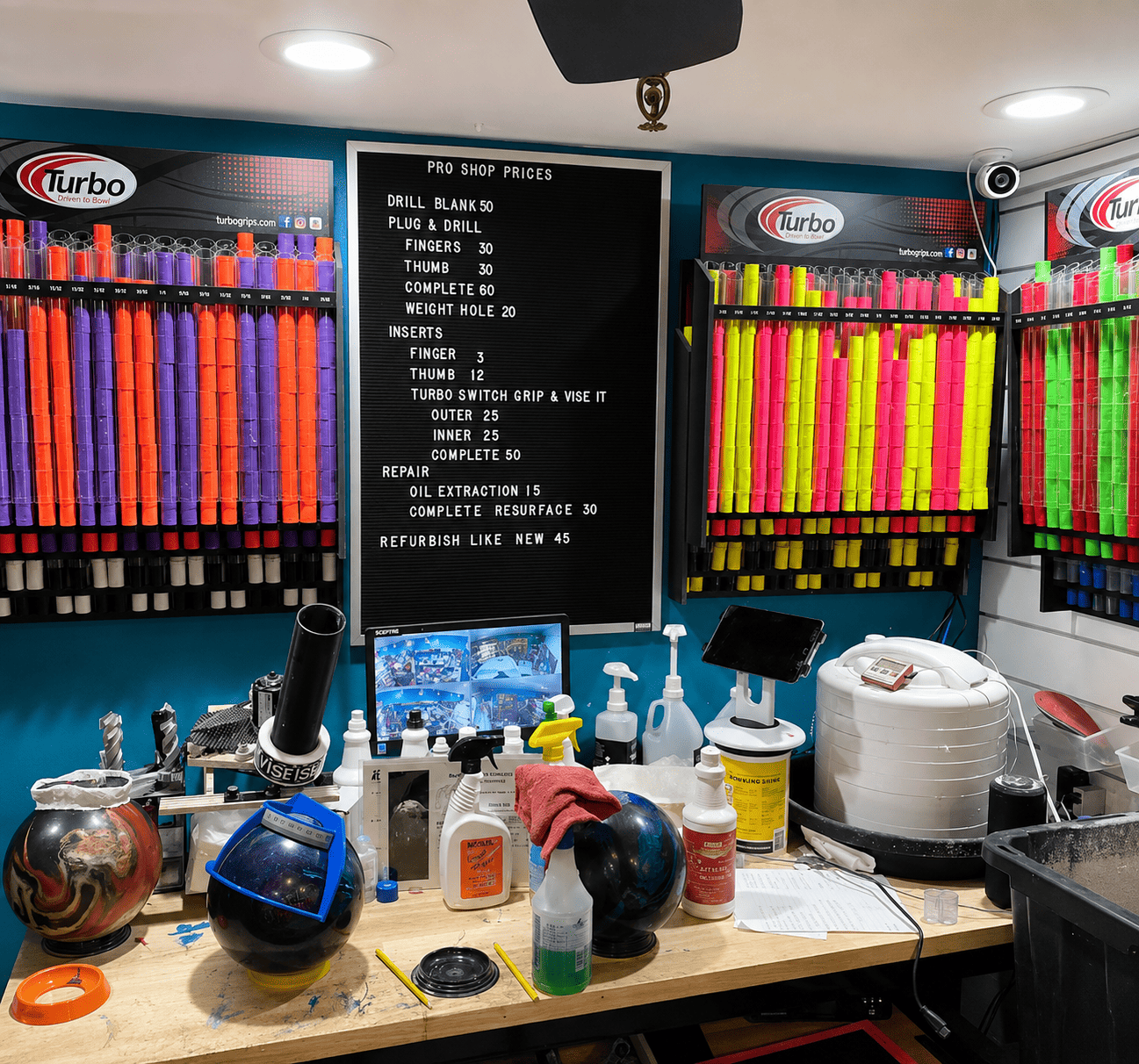 Bowler's Rx Pro Shop interior at Paddock Bowl - drilling equipment, bowling balls, and services board