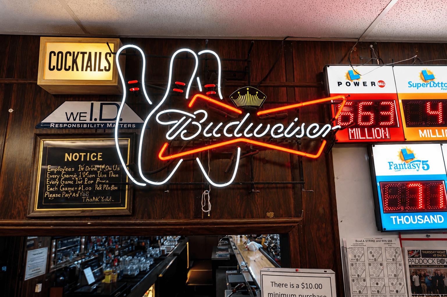 Paddock Bowl bar area with neon signs