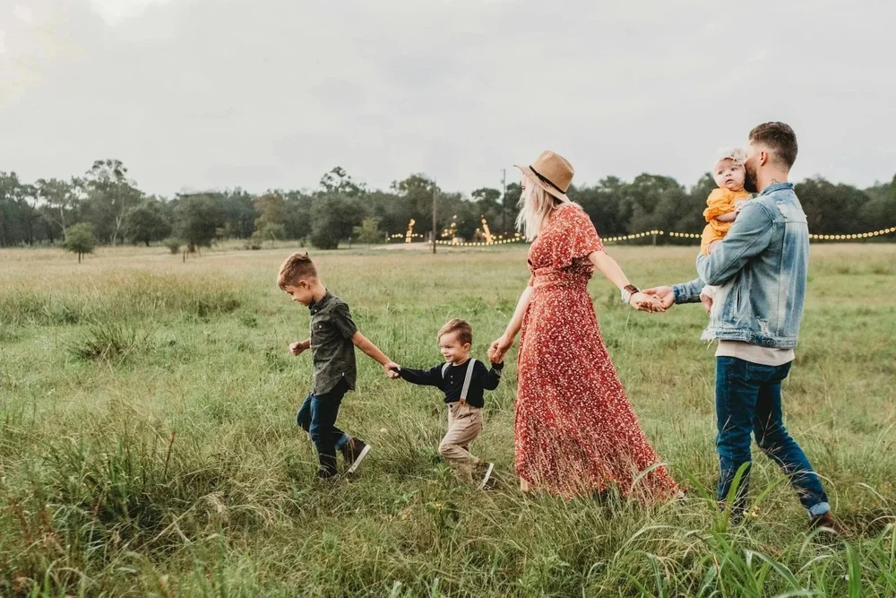 Family walking together in a field